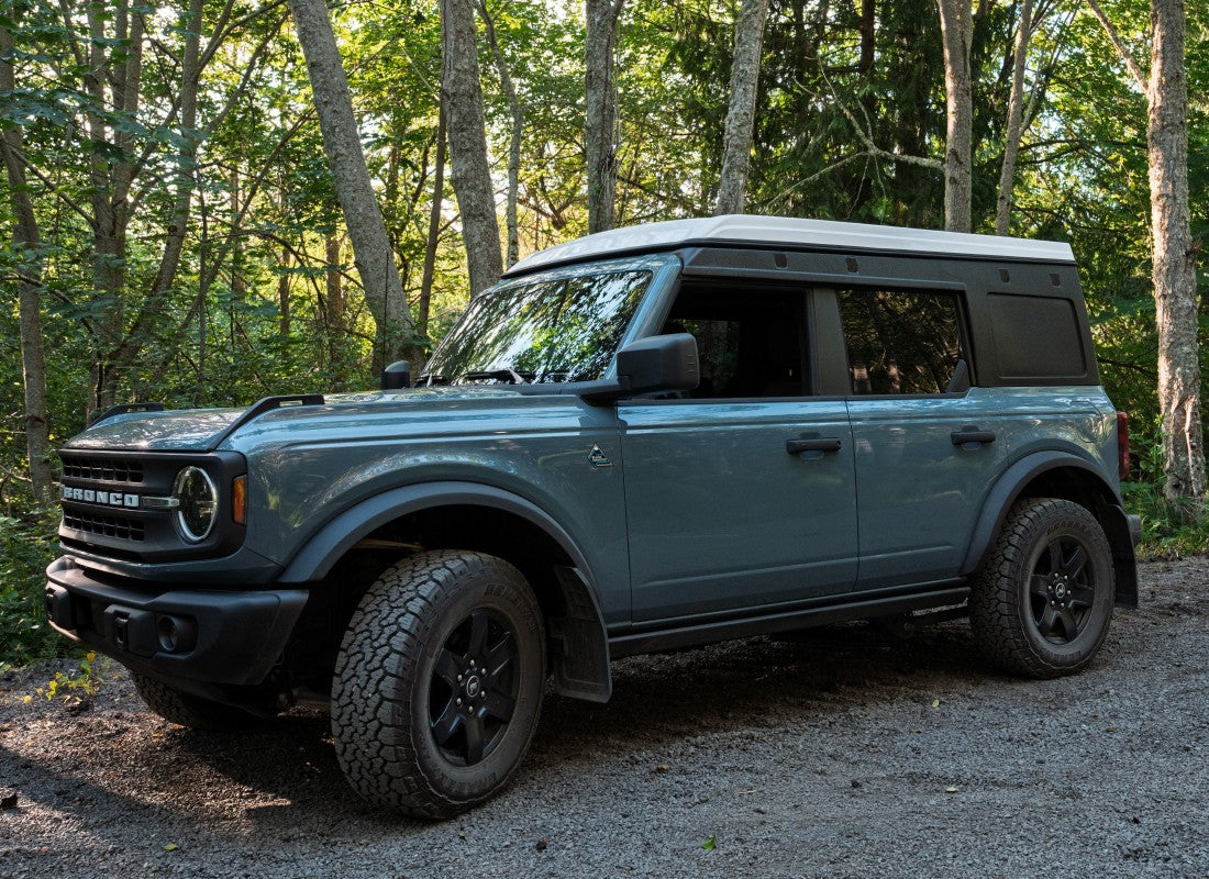 Bronco with Ursa Minor Camper closed in the forest